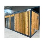 Contenedor oficina 6x3m nuevo con baño completo y puerta corredera.